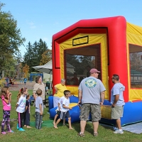 children playing in bouncy house