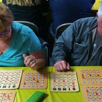 man and woman playing bingo