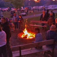people at a bonfire at campground