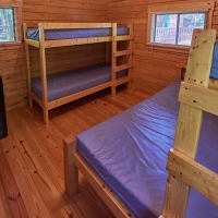 four bunk beds and microwave