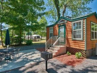 Outside of small cabin with patio