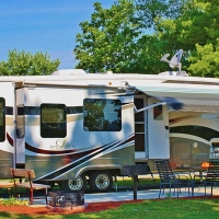 White and brown camper with awning