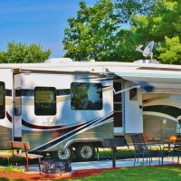 camper  with table, chairs and grill