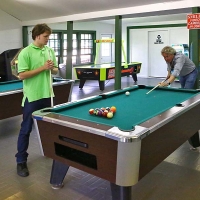 two men playing billiards