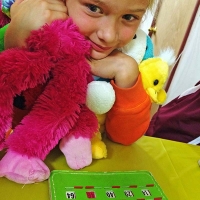 girl with stuffed animals