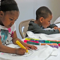 kids coloring with markers